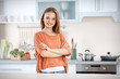 © Africa Studio - Young woman in the kitchen