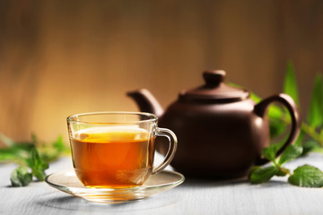 Wall Mural - Cup of tea and teapot on table