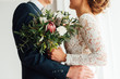 © ruslan_shramko - bride and groom together holding wedding bouquet
