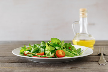 Poster - plate of fresh salad with carafe of oil