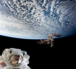 Wall Mural - planet earth astronaut spaceman helmet suit outer spacewalk international space station. elements of