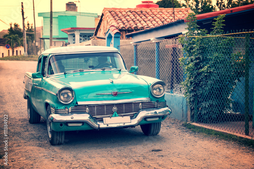Old classic american car in a street of Vinales, Cuba Plakát