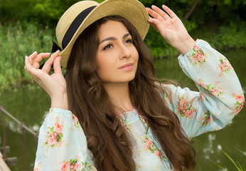 beautiful girl in a dress and hat