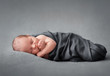 © luckybusiness - sleeping newborn baby on a blanket