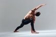 © Drobot Dean - Handsome man doing yoga exercise