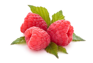 Wall Mural - Fresh raspberries with leaves.