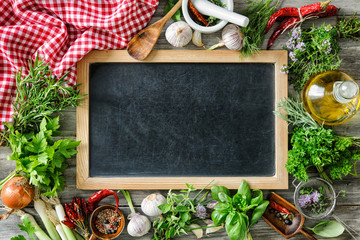 Wall Mural - fresh herbs and spices on wooden table