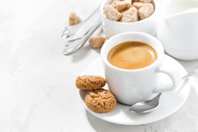 Cup Of Espresso And Almond Cookies On A White Table, Horizontal