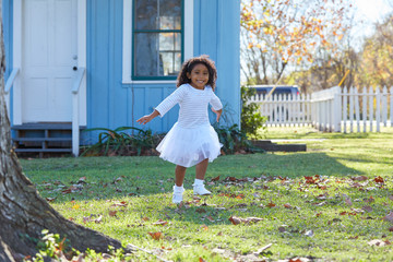 Wall Mural - kid toddler girl white dress running in park