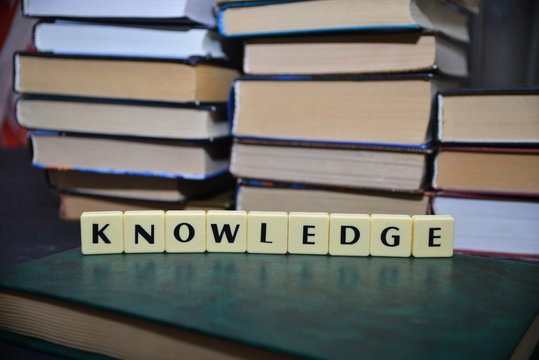 word knowledge near the pile of books