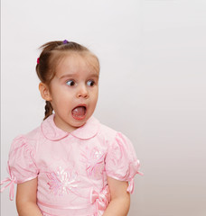 shocked screaming little girl with opened mouth