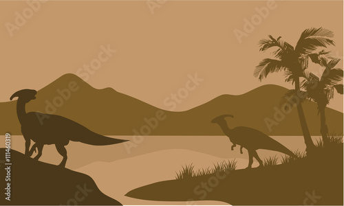 Fotografía Silhouette of parasaurolophus in lake