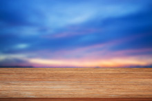 Top Of Wooden Table On Blue Sunset Sky Background