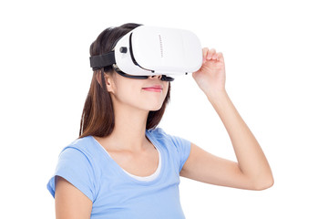 Wall Mural - Woman looking via vr device