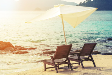 Wall Mural - Beach chairs with parasol on the beach, soft focus, vintage tone