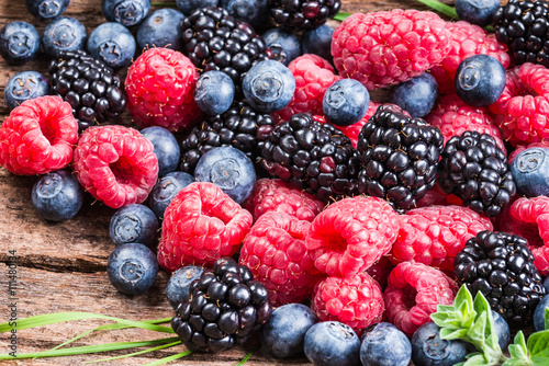 Fotografie, Obraz Fresh berries, blueberry, raspberry, blackberry closeup background