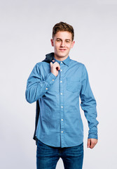 Wall Mural - Boy in jeans and shirt, young man, studio shot