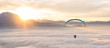 © RooM The Agency - Man paragliding above clouds, Alps, Salzburg, Austria