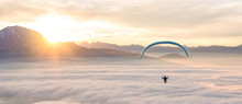 Man Paragliding Above Clouds, Alps, Salzburg, Austria