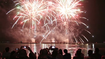 Wall Mural - people with smartphones watching fireworks
