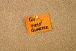 Q1 as FIRST QUARTER written on orange paper note