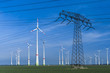 © lupolucis - Strommast mit Windrädern