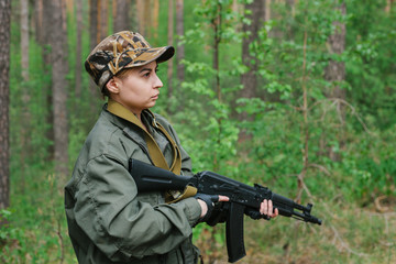 Wall Mural - A woman soldier with a weapon