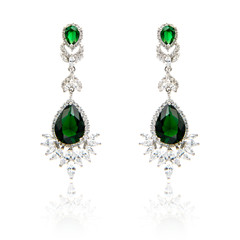 Pair of emerald earrings isolated on white
