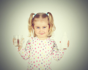 little girl holding filter for drinking water and glass of clea