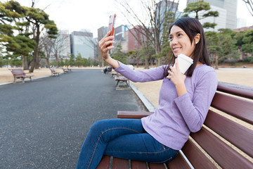 Sticker - Woman take self image at outdoor park