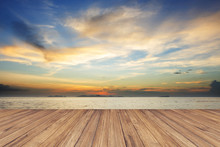 Perspective Of Wood Terrace Against Beautiful Seascape At Sunset