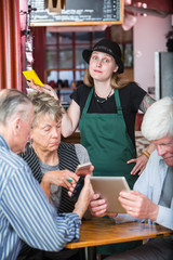 Wall Mural - Frustrated Server Waiting on Customers with Electronics