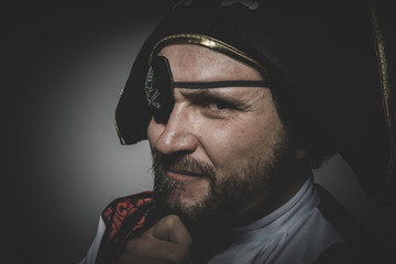 sexy man pirate with eye patch and old hat with funny faces and