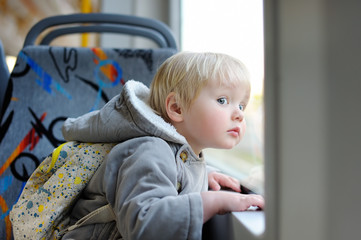 Toddler boy in train or tram