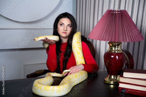Poster Beautiful sexy girl holding a white albino python