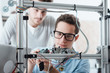 © StockPhotoPro - Young engineers 3D printing