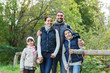 © Syda Productions - happy family with backpacks hiking