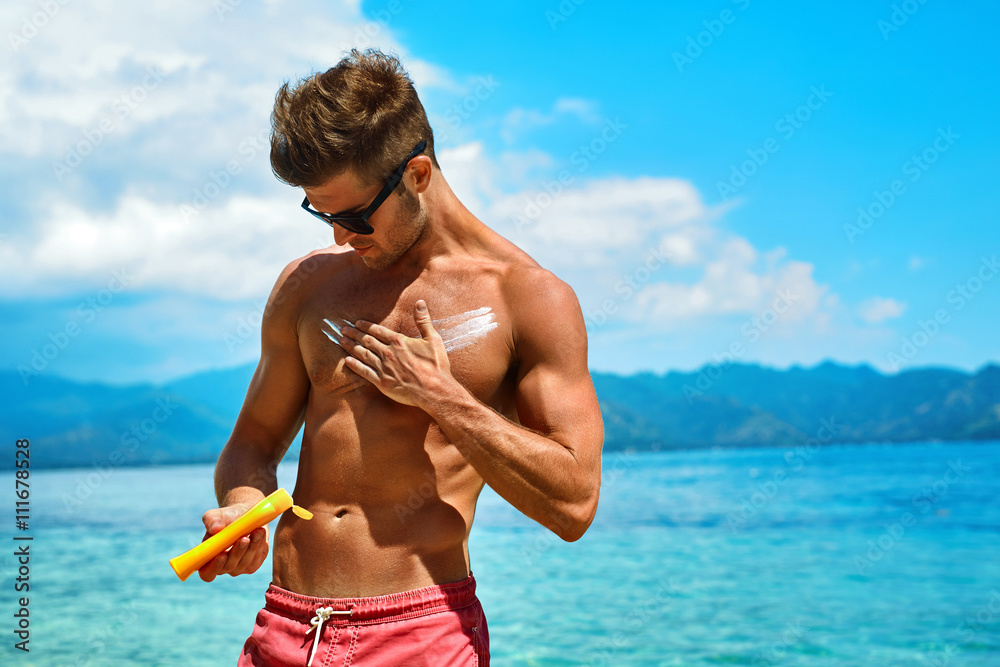 Man Skin Care In Summer. Handsome Male With Sexy Body In Sunglasses ...