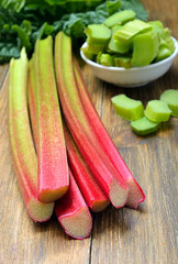 Wall Mural - Fresh rhubarb on wooden table