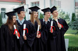 © unguryanu - Group of graduates with diplomas in their hands