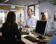 © Johnér - A man and a woman in an office, Sweden.