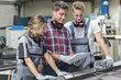 young apprentice with professional metallurgist