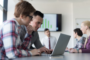 young business couple working on laptop, businesspeople group on