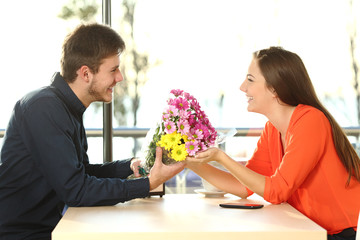 Wall Mural - Couple date with man giving flowers