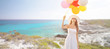 © Syda Productions - smiling young woman in sunglasses with balloons