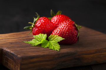 Wall Mural - Ripe fresh strawberries with leaf