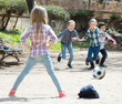 © JackF - Junior kids playing street football outdoors