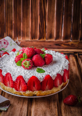 Wall Mural - no baked Strawberry Cheesecake with cottage cheese on wooden background, selective focus.