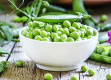 Peeled Pea Green Peas In A White Porcelain Bowl, Vintage Wooden