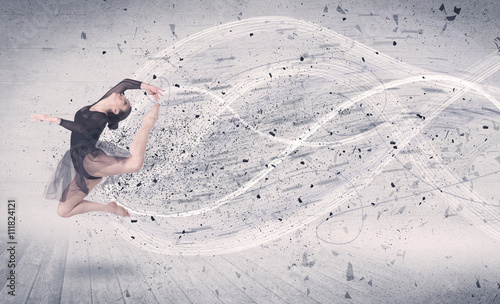 Obraz Dibond Performance ballet dancer jumping with energy explosion particle